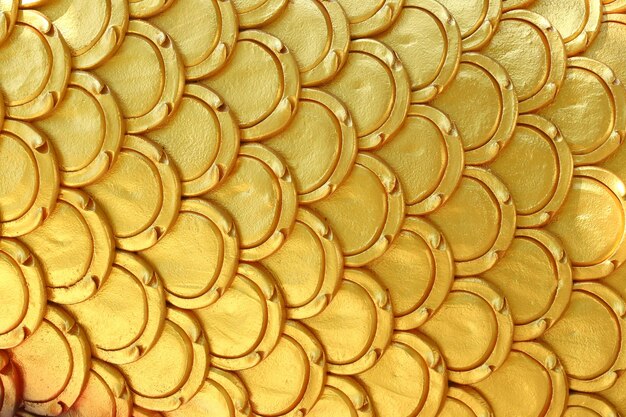 Gold patterns of stucco shaped like fish scales