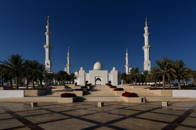 Grand mosque against clear blue sky