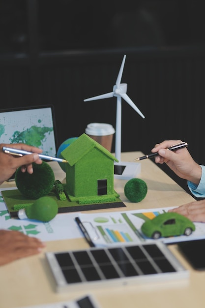 Green energy business company meeting with business people planning and discuss marketing of sustainable and renewable clean energy product with solar cell and wind turbine generator Trailblazing