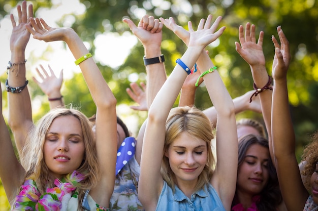 Group of friends dancing at music festival