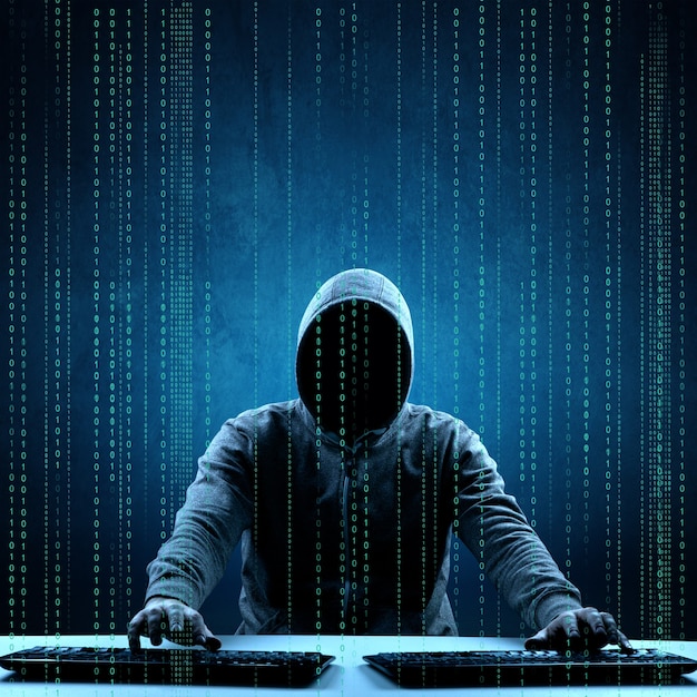 Hacker prints a code on a laptop keyboard to break into a cyberspace