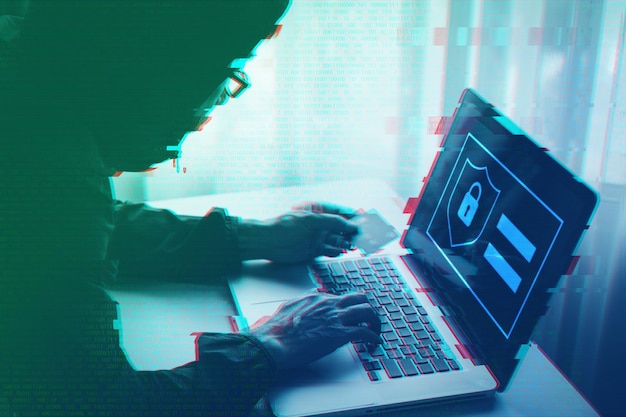 Hacker tried to scam credit card with digital interface laptop computer Internet data security crime concept
