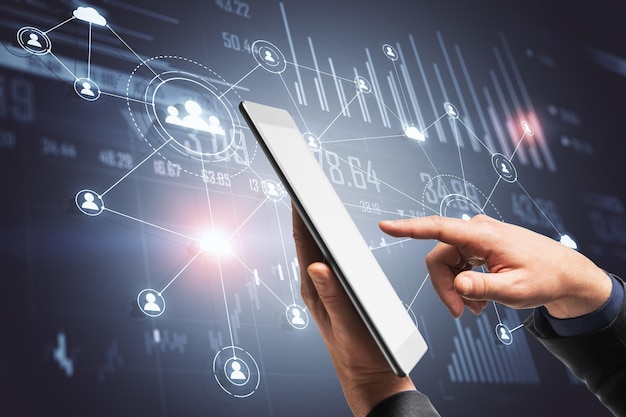 Hand using tablet with global social network interface