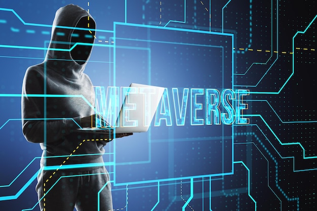 Hcker using laptop with glowing metaverse text hologram on blurry tech background Digital world hacking and future concept Double exposure