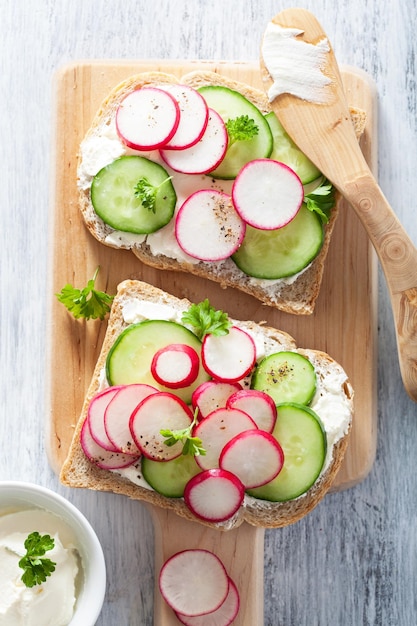 Healthy sandwich with radish cucumber and cream cheese