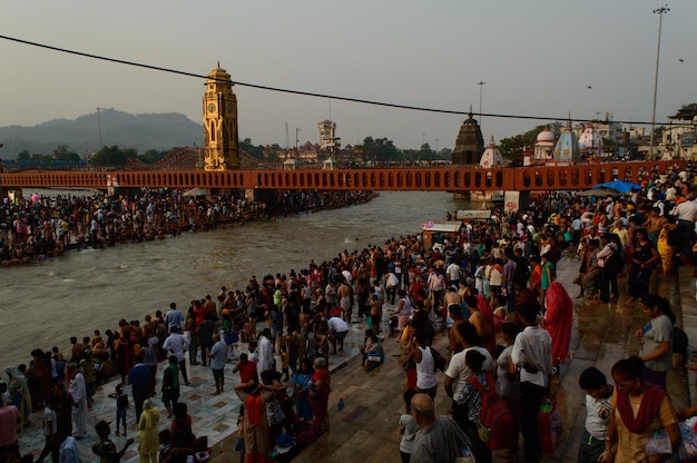 Heavy crowd going to take bath into ganga river due to saavan festival at haridwar bridge temple