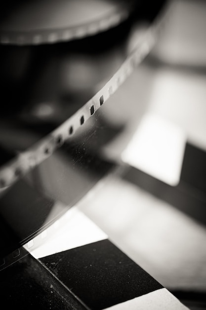 High angle view of film reel with slate on table