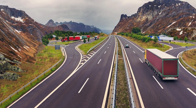 High angle view of vehicles on road amidst mountains against sky