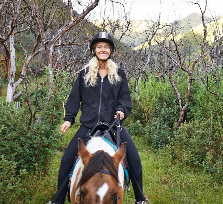 Foto horse riding and portrait of woman on adventure in vacation or holiday journey on path in nature training animal and person travel on trail with pet in countryside woods and summer with happiness