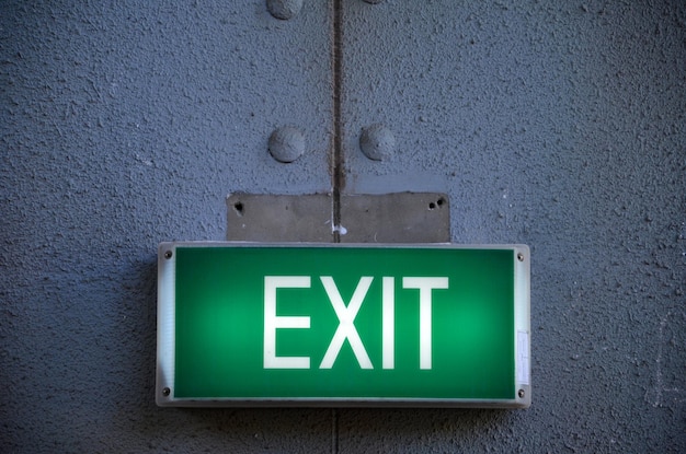 Illuminated exit sign on wall
