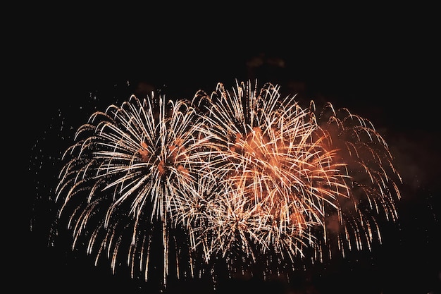 Illuminated firework display against clear sky at night during new years eve
