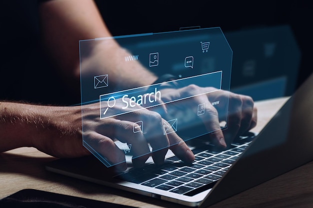 Internet search in the global Internet The person is working behind a laptop and a holographic display