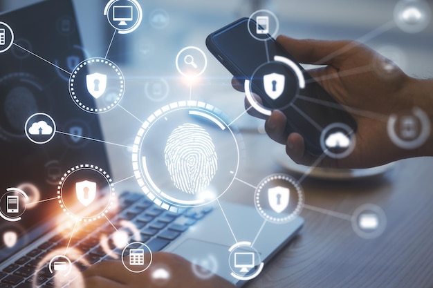 Internet security and access concept with digital icons of fingerprint keyhole cloud and man hands with laptop and smartphone Double exposure