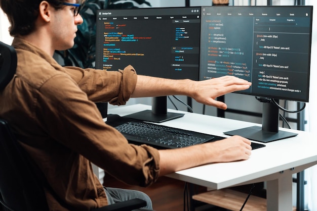 It developer working online software development coding on pc screens gusher