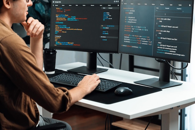 It developer working online software development coding on pc screens gusher