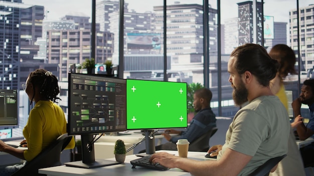 IT specialist programming using chroma key computer