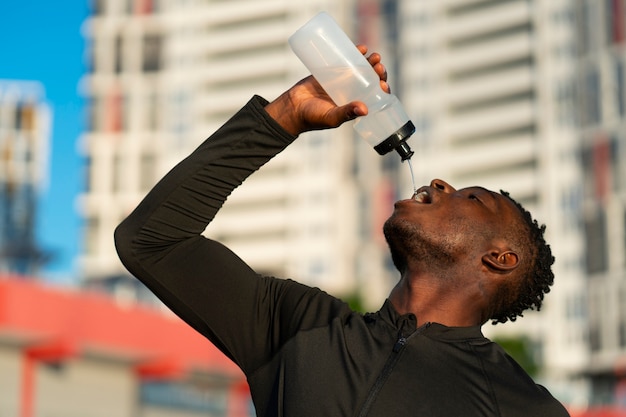 Low angle man drinking water