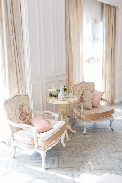 Luxurious expensive interior design room in the old Baroque style in beige colors