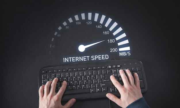 Male hands typing in keyboard Speedometer Internet speed