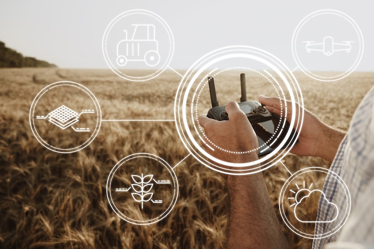Foto man farmer standing in wheat field and controlling drone close up. technologies in agriculture concept