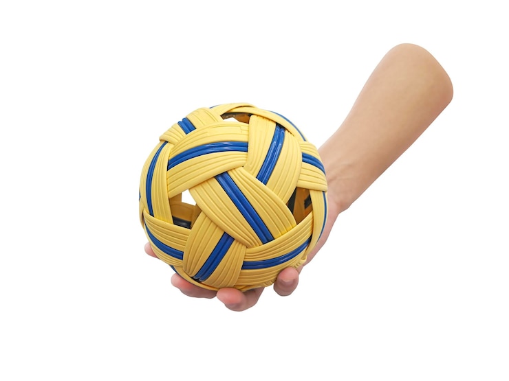 Foto man hold sepak takraw ball on white background
