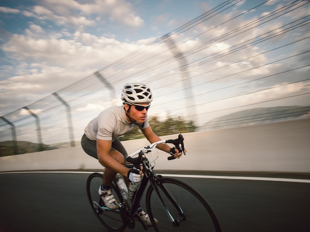 Man riding bicycle on road