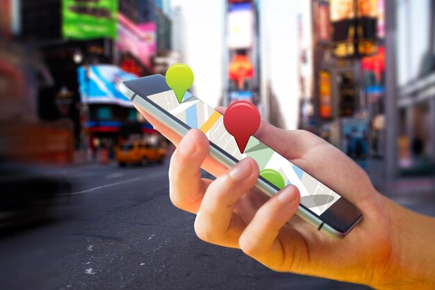 Man using map app on phone against blurry new york street
