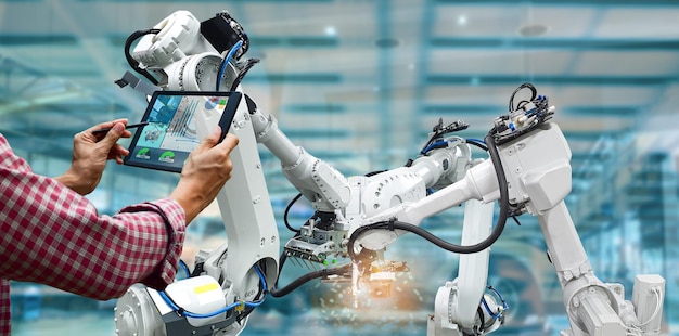Manufacturing industry by robots artificial intelligence and engineers