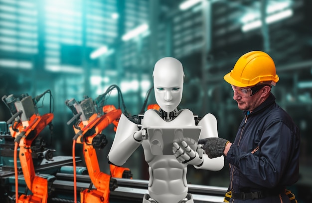 Mekanisk industrirobot og menneskelig arbeider som jobber sammen i fremtidens fabrikk