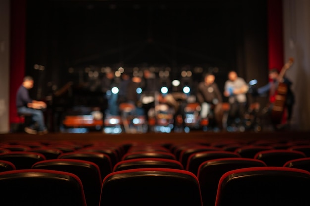 men on stage in auditorium