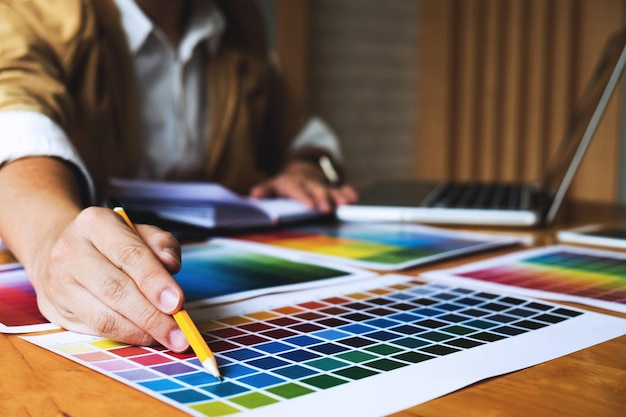 midsection of man working at creative office