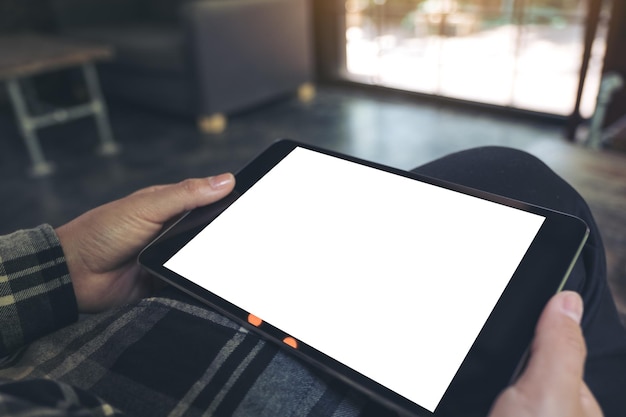 midsection of woman holding blank digital tablet