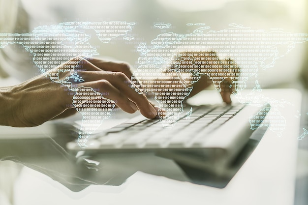 Multi exposure of abstract graphic world map and hands typing on computer keyboard on background big data and networking concept
