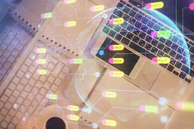 multi exposure of data theme drawing hologram over topview work desk background with computer concept of technology