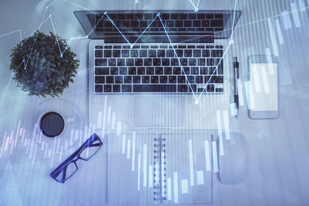 multi exposure of forex chart drawing over table background with computer concept of financial research and analysis top view