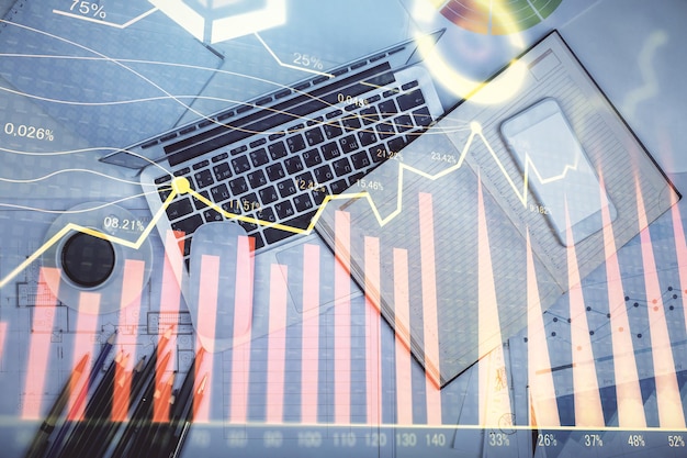 multi exposure of forex chart drawing over table background with computer concept of financial research and analysis top view