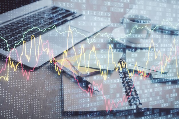Multi exposure of forex graph drawing and desktop with coffee and items on table background Concept of financial market trading