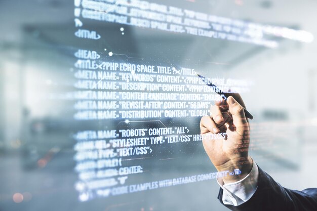 Multi exposure of man hand with pen working with abstract software development hologram on blurred office background research and analytics concept