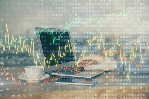 Multi exposure of market chart with man working on computer on background Concept of financial analysis
