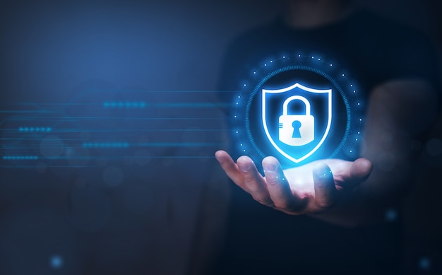network security and data protection businessman holding  padlock in hand global networking