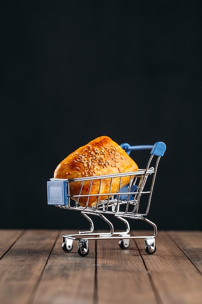 Oriental dish baked pie with meat samsa in miniature trolley