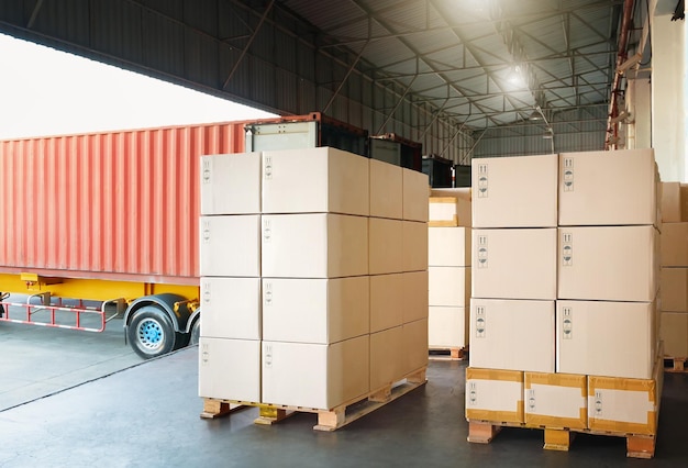 Package Boxes Stacked on Pallets Loading Goods into Container Trucks Logistics Transportation