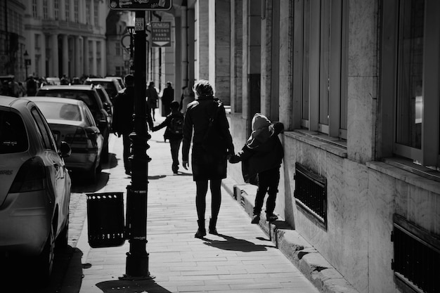 People walking on sidewalk in city