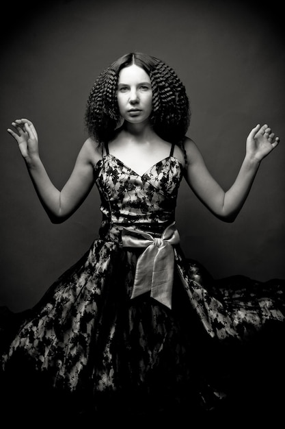 Portrait of pretty young woman with curly hair