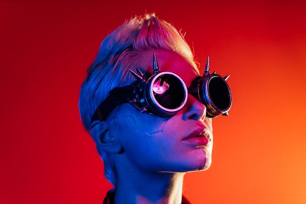 portrait of woman wearing sunglasses against yellow background