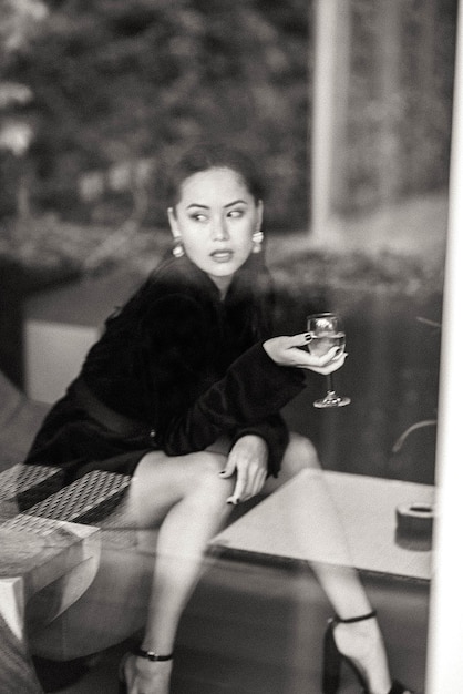 portrait of young woman sitting on chair