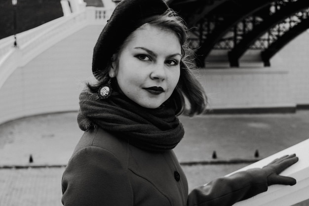 portrait of young woman standing outdoors during winter