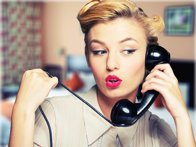 Portrait of young woman using phone