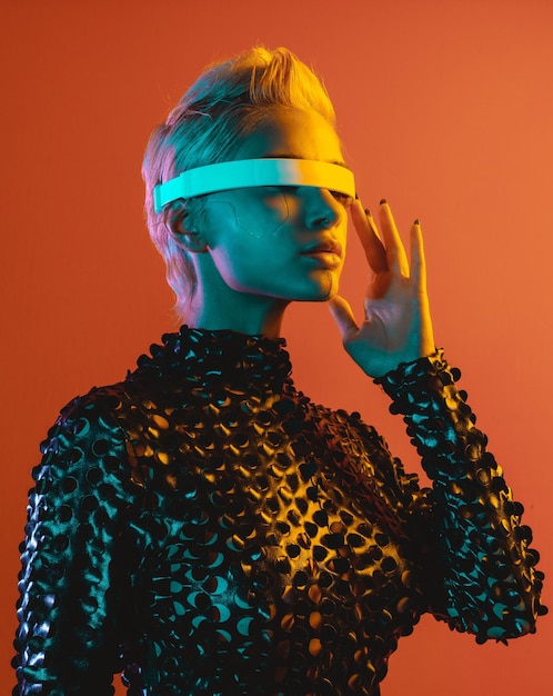 rear view of woman standing against yellow background