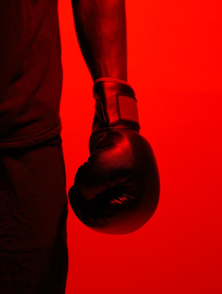 Foto red light man and hand with boxing gloves in studio background for sports match male person sportsman and athlete with training workout and exercise with fitness for competition as boxer
